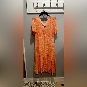 A light coral dress that is perfect for any occasion